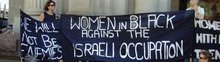 Melbourne Women in Black holding banners that say ''We will not be enemies'' and ''Women in Black against the Israeli Occupation.''