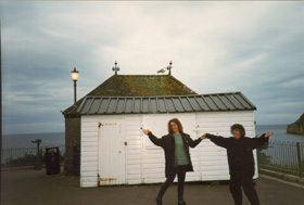 Dancing with Di near the ocean in Devon, England, under a cloudy and darkening sky