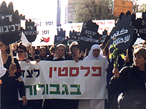 Marchers holding right side of banner